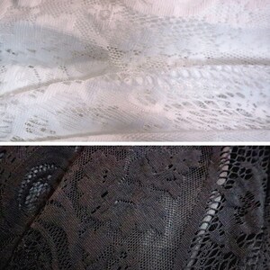 May include: Close-up of two pieces of lace fabric. The top piece is white and the bottom piece is black.