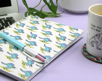 Skiing dinosaur A5 spiral-bound notebook