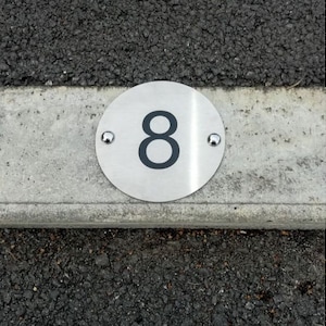 Parking space numbers in 11.5cm diameter stainless steel