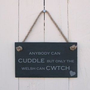 Hanging Sign &#39;Anybody Can Cuddle but Only the Welsh Can Cwtch&#39;