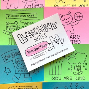 May include: A set of colorful lunchbox notes with encouraging messages and illustrations. The notes feature phrases like "You Got This!" and "You Are Kind".