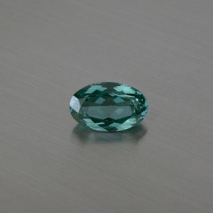 Spinel synthetic 7x13,8x16,9 x 13,10x16 mm green/blue (color changing) oval