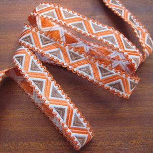 Vintage woven jacquard ribbon trim with embroidered geometric motifs