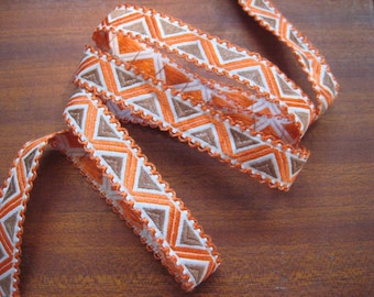 Vintage woven jacquard ribbon trim with embroidered geometric motifs