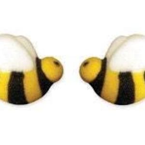 May include: A pair of bee-shaped earrings. Each earring features a yellow head and body with black stripes, and white wings. The earrings are designed to resemble a bumblebee.
