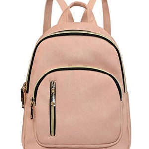 May include: A light pink faux leather backpack with black and gold zipper accents. The backpack has a front pocket with a zipper.