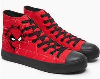 May include: Red high-top canvas sneakers with a black spider-man design and black laces.