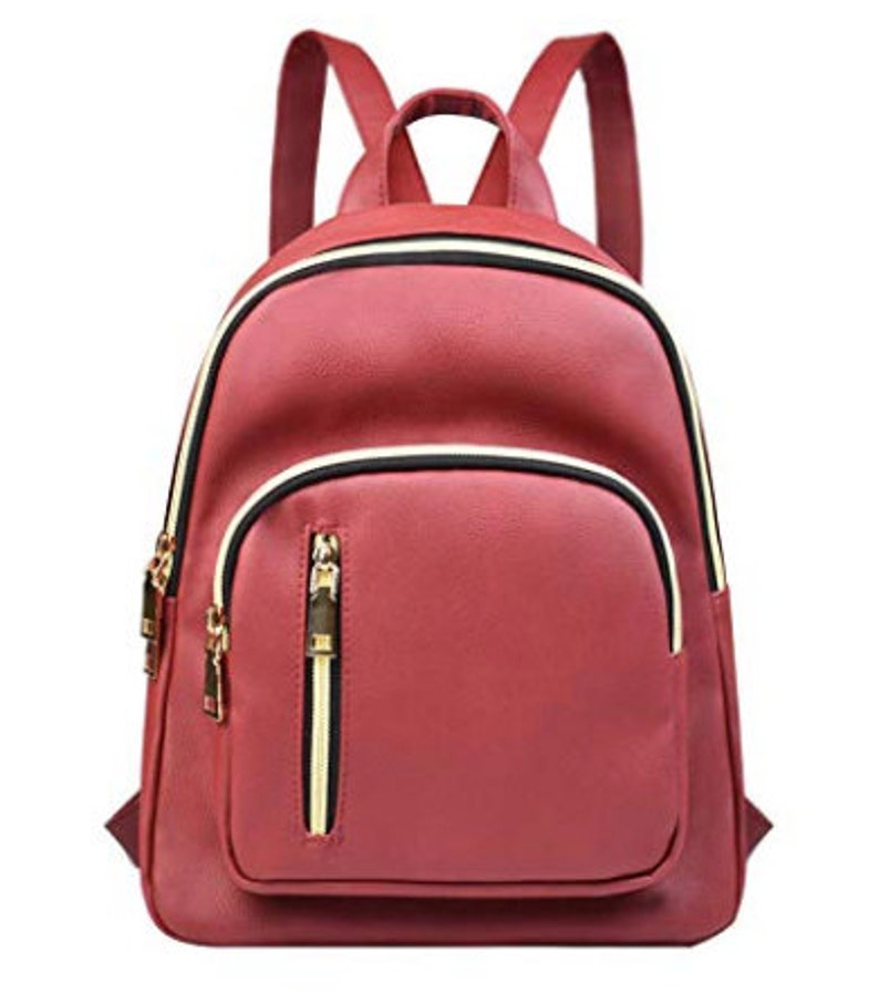 May include: A burgundy faux leather backpack with gold zipper accents and a front pocket.