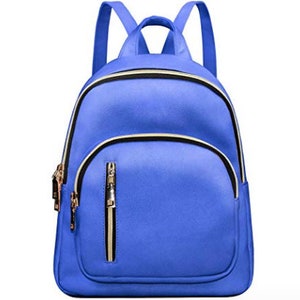 May include: A blue faux leather backpack with gold zipper accents and a front pocket.