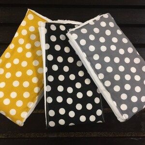 Polka dot burp cloths in mustard, gray, and black