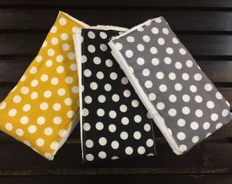 Polka dot burp cloths in mustard, gray, and black