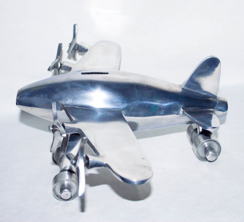 Vintage Large Polished Aluminum Airplane Coin Bank. image 0