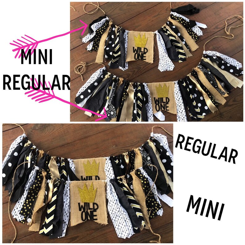 May include: Two burlap banners with the text "Wild One" in black lettering and a gold crown. The banners are decorated with black, white, and gold fabric scraps. The smaller banner is labelled "mini" and the larger banner is labelled "regular".