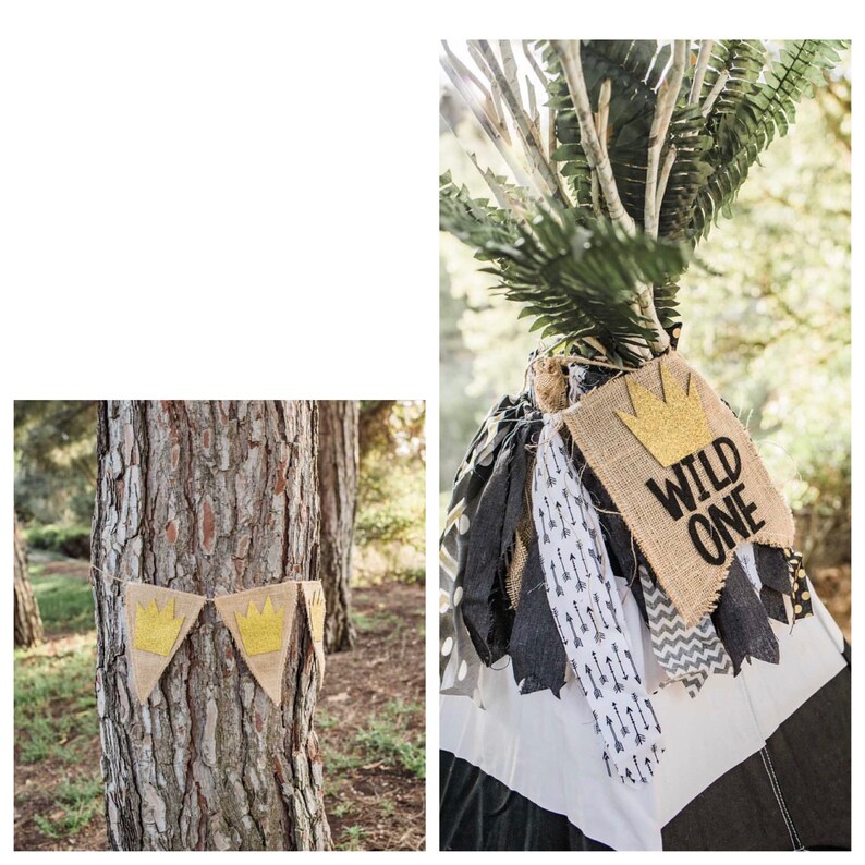 May include: A woodland-themed party banner with a hessian background and gold glitter crowns. The banner reads "Wild One".