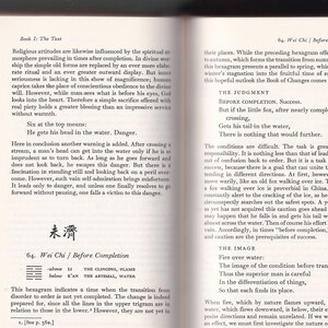 May include: Open book pages with text and a Chinese symbol. The text discusses religious attitudes and the Book of Changes. The pages are yellowed, suggesting age. The book is likely a guide or commentary.