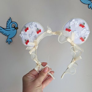 Cherry Mickey and Minnie inspired bow and pearl cottage core Mickey Ears. Pearl mouse ears for the Parks