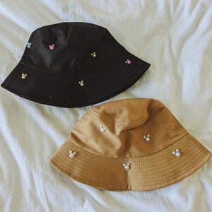 You choose colors! Mickey Pearl Bucket Hat. Brown or Black hat with Rainbow or White Mickeys