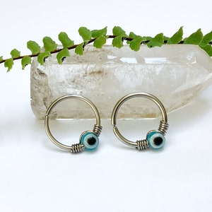 Boze oog titanium piercing, 0,8 mm, 1 mm /18g, 1,2 mm/16g, septum ring, helix, conch, tragus, daith, kwab, neus, oor, geluksbrenger