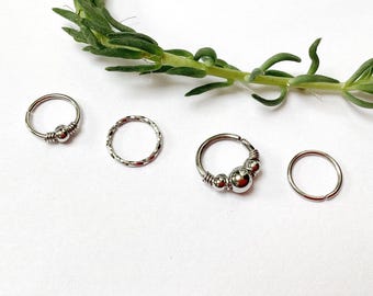 Set of 4 stainless steel piercings, 20G and 18G, including helix, conch, septum, nose, nostril, daith, rook, cartilage, eyebrow, labret, upper lobe, and hoop earrings.
