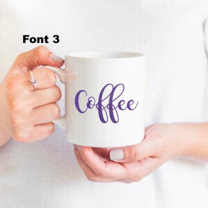 May include: White ceramic mug with a purple cursive inscription that reads "Coffee".