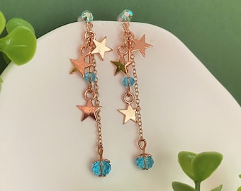 turquoise colored pearl earrings, rose gold stars, customizable designer costume jewelery