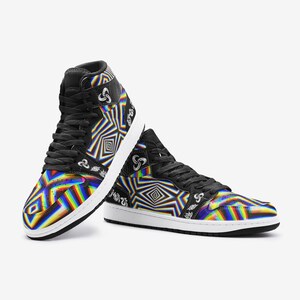 May include: A pair of black high-top trainers with a colourful, geometric pattern. The pattern features a rainbow of colours, including red, orange, yellow, green, blue, indigo, and violet. The trainers have a white sole and black laces.