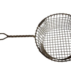May include: A vintage wire mesh strainer with a twisted metal handle. The strainer is round and has a fine mesh. It is made of metal and has a rustic look.