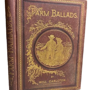 May include: Antique book titled "Farm Ballads" by Will Carleton. The cover is a deep burgundy with gold lettering and illustrations. The book's spine also features the title in gold.