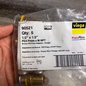 May include: A package of five 1/2 inch by 1/2 inch bronze PEX press x M NPT adapters. The package is labeled with the Viega PureFlow System logo and the product number 90521. The package is made in Germany.