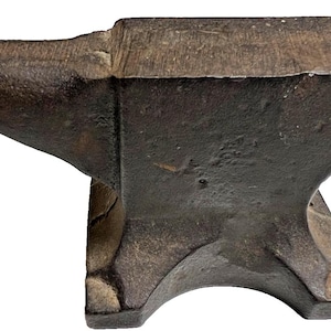 May include: A heavy, dark gray cast iron anvil featuring a flat top surface, a pointed horn extending to the left, and a sturdy base with four feet. The metal surface shows a weathered, textured finish with visible signs of age and use.
