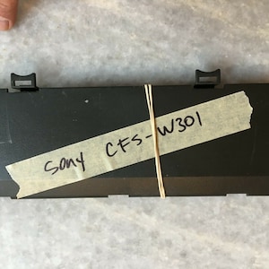 Sony cfs-w301 boombox replacement parts: oem/original battery cover plate