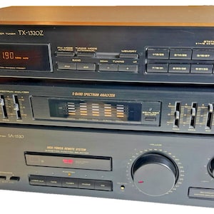 May include: A stack of three black Pioneer audio components. The top unit is a TX-1320Z digital synthesiser tuner with a digital display. The middle unit is a graphic equaliser with a spectrum analyser. The bottom unit is an SA-1530 stereo amplifier.