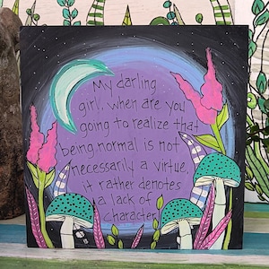 May include: Square artwork with a black background featuring a crescent moon, mushrooms, and flowers. The artwork has the text: "My darling girl, when are you going to realize that being normal is not necessarily a virtue, it rather denotes a lack of character."