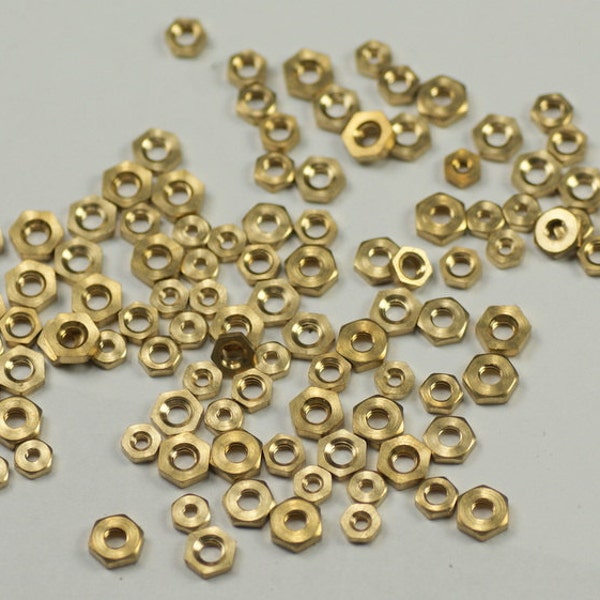 100 Brass clock nuts assorted clockmakers parts spares repairs 3-7mm movement