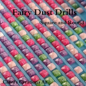 May include: Close-up of rows of colorful square and round diamond painting drills. The drills are arranged in rows on a blue plastic tray. The text "Fairy Dust Drills" and "Square and Round" is visible in the image. The text "Carol's Creations Az" is visible at the bottom of the image.