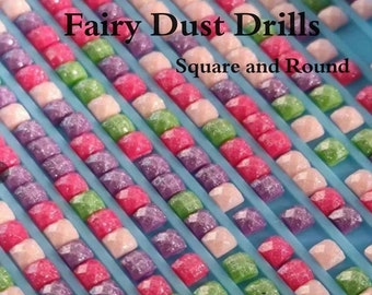 May include: Close-up of rows of colorful square and round diamond painting drills. The drills are arranged in rows on a blue plastic tray. The text "Fairy Dust Drills" and "Square and Round" is visible in the image. The text "Carol's Creations Az" is visible at the bottom of the image.