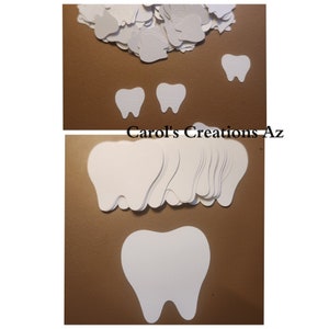 May include: A stack of white paper tooth shapes, with two smaller teeth and one larger tooth on a brown background. The text "Carol's Creations-Az" is visible in the image.