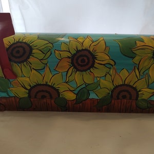 Hand painted standard mailbox. Painted in pretty sunflowers with teal background.  Sealed and uv protected,