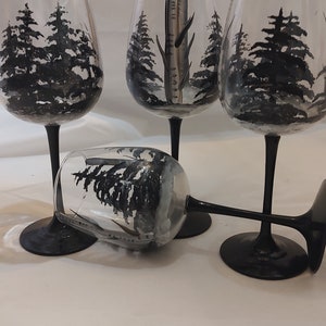 Hand painted winter birch trees and black pines. . Set of 4. 18.5 ounces white wines. black stem . usa. dishwashter top rack safe.
