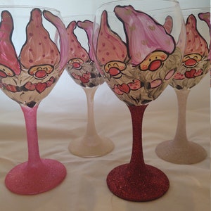 Hand painted valentine gnomes. Glitter stem and base. . Set of 4 red wine OS glasses/goblets. Hand painted.