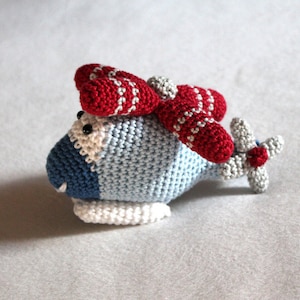 Jouet de préhension ebook au crochet / hélicoptère hochet