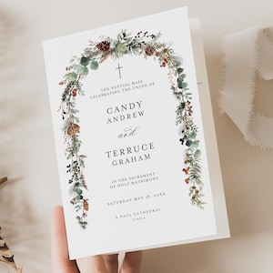 May include: A wedding invitation featuring a watercolour illustration of a floral wreath with a cross at the top. The text reads "The nuptial mass celebrating the union of Candy Andrew and Terruce Graham in the sacrament of holy matrimony Saturday May 18, 20XX S.Paul Cathedral London."
