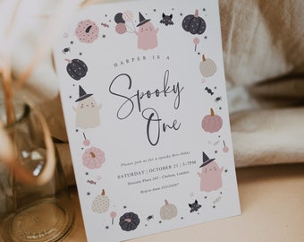 May include: A Halloween-themed invitation with the text "HARPER IS A Spooky One." The invitation features illustrations of ghosts, pumpkins, bats, and stars in a soft color palette of pink, gray, and black. The invitation includes event details.