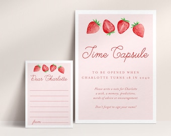 May include: A pink and red time capsule card with strawberries and the text "Time Capsule" and "To be opened when Charlotte turns 18 in 2040". A smaller card with the text "Dear Charlotte" and lines for writing a message.