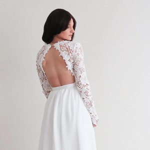Flowy Wedding Dress with Chiffon Skirt and Lace. Open lace back and long sleeves. Elegant dress for romantic and bohemian wedding