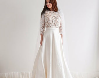 Robe de mariée longue en soie et dentelle, style princesse avec traîne. Robe dentelle manches 3/4, jupe trapèze, mariage luxe