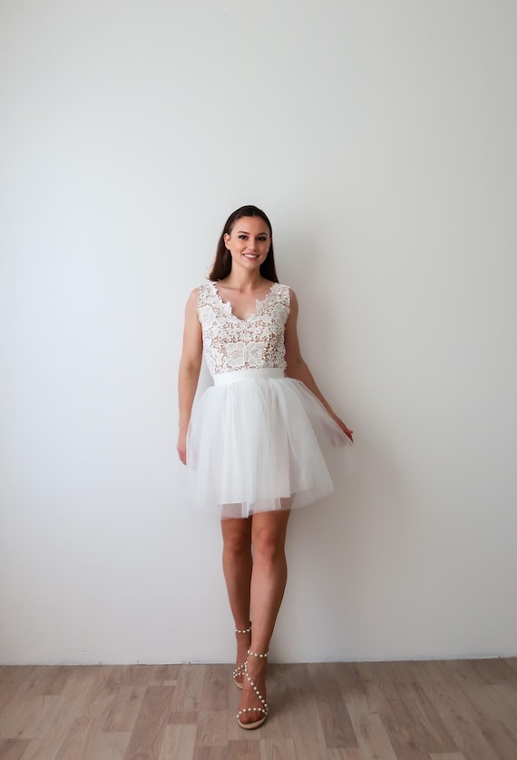 Elegant civil wedding dress with a short tulle skirt and open lace back. Tutu wedding dress, engagement dress, chic and boho brunch mini-dress