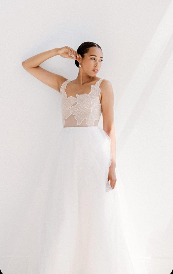 boho wedding dress 2025 ETSY DESIGN AWARDS Modern Tulle Floral Embroidery. Handmade and Customizable Romantic Wedding Back Details 04/30/2026 Delivery Azazie Cora Bridesmaids Dress Size:Black