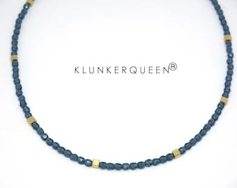 Necklace with small, light blue glass stones with gold