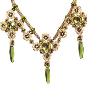 May include: A gold and green beaded necklace with three pendant drops. The necklace features a geometric design with multiple layers of beads.